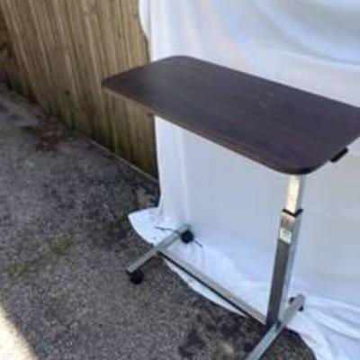 Adjustable bedside table
