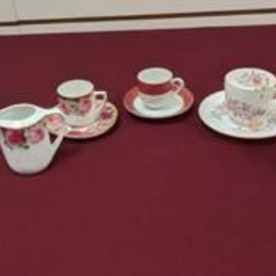 3 cups and saucers and two picher