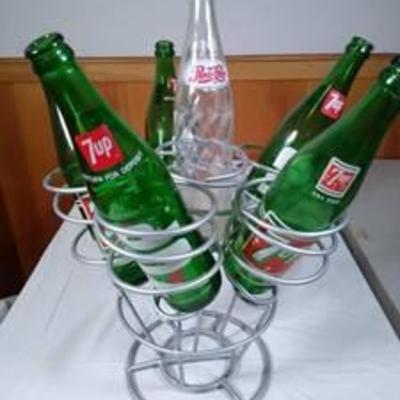 Wine bottle holder with vintage glass soda bottles