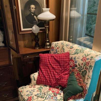 One of a pair of floral wing back chairs. 
