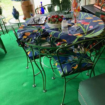 Superior wrought iron table and chairs.