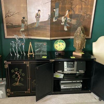 Technics SA 100 reciever. Garrard GT 350 AP turntable. Two Chinese style cabinets and a 4 fold hanging wall screen.