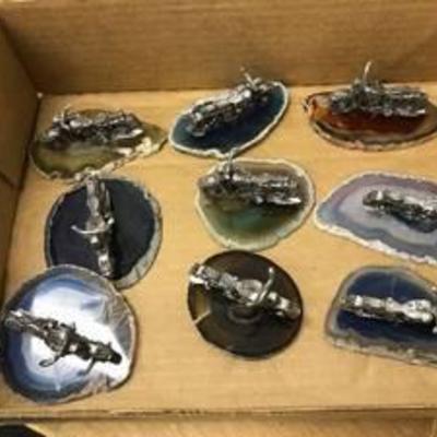 9 motorcycle figurines on geode slabs