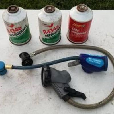 3 cans of R-134a refrigerant and two gauges