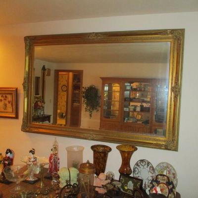 Way huge fancy mirror. 