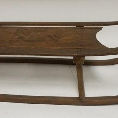 1006	ANTIQUE SMALL CHILDS SLED W/LION DESIGN ON MAIN BOARD, 31 IN LONG
