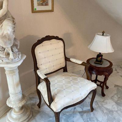 One of a pair of fancy arm chairs