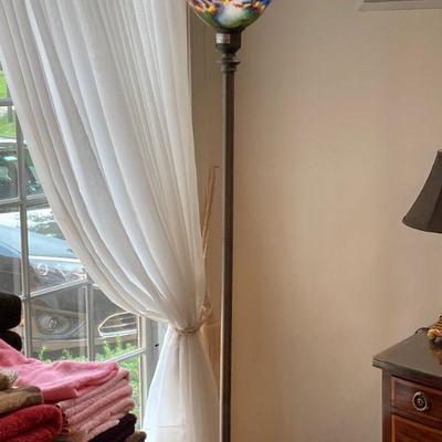 Floor lamp with multi colored glass shade