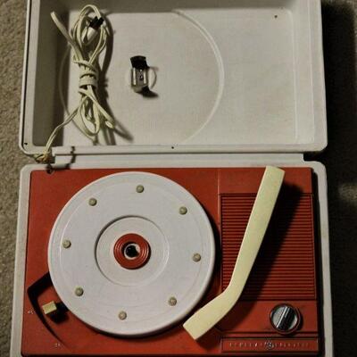 Rock around the Clock with this General Electric vintage compact record player.  