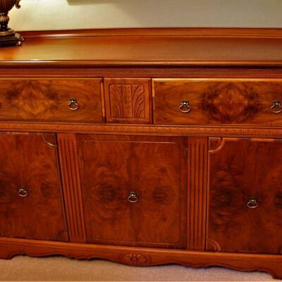 Gorgeous marbled wood credenza is as functional as it is attractive.