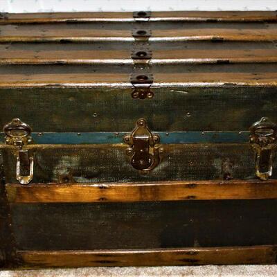 Antique steamer provides a wonderful decorative accent and is functional for storage also.