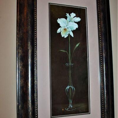 Framed floral artwork.