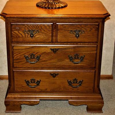 A pair of matching nightstands each with plenty of storage for your bedside necessities.
