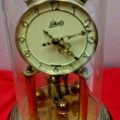 https://www.ebay.com/itm/124377651439	LX3030 10 INCH HIGH USED VINTAGE LCHATZ WIND UP BRASS CLOCK WITH GLASS DOME 		 $23.00 	 Buy-It-Now 
