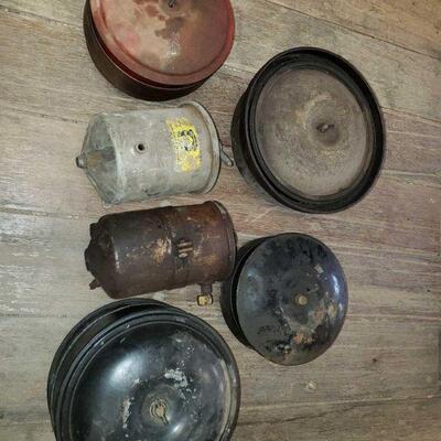 7610	

4 Vintage Air Cleaners And 2 Oil Filters
4 Vintage Air Cleaners And 2 Oil Filters