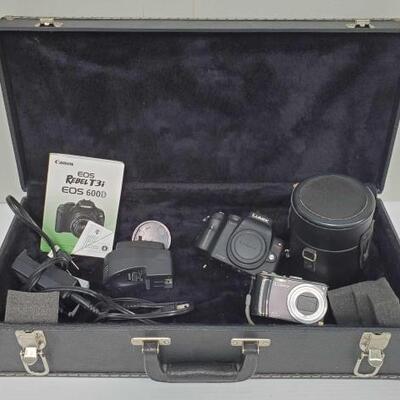 1426	

2 LUMIX Cameras, 1 Canon Lens, 2 Battery Chargers, and More!
2 LUMIX Cameras, 1 Canon Lens, 2 Battery Chargers, and More!
