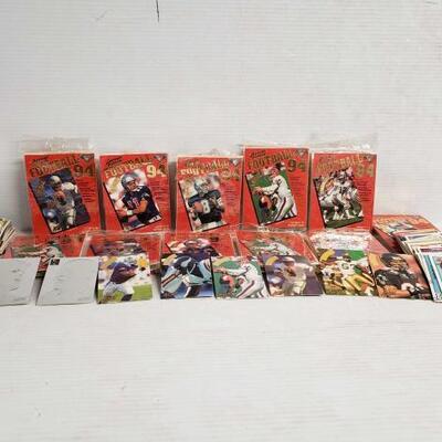 #7157 â€¢ Football Cards, And Baseball Cards