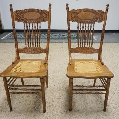 1054	PAIR OF OAK PRESSED BACK CHAIRS
