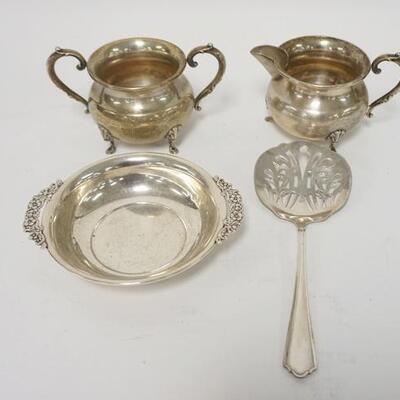 1064	4 PIECES OF STERLING SILVER, SMALL BOWL, CREAMER, SUGAR & SLOTTED SPOON, 9.71 TOZ TOTAL
