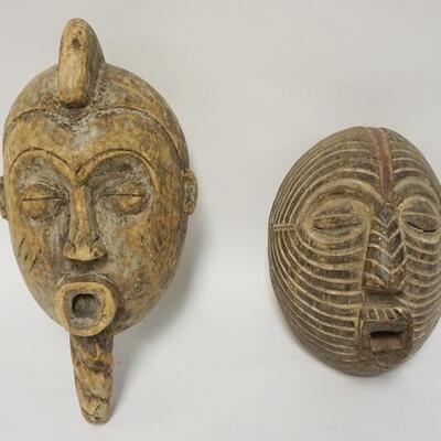 1006	LOT OF 2 ETHNIC WOOD CARVED MASKS, 17 IN X 7 IN
