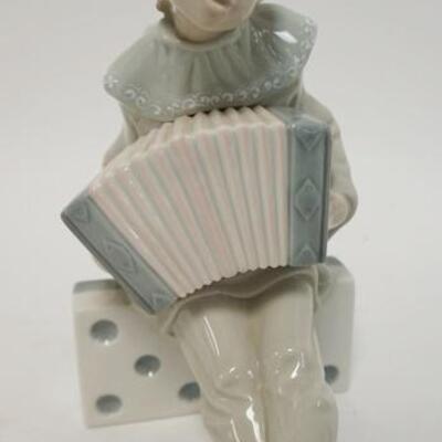 1040	LLADRO YOUNG BOY ON DOMINO PLAYING CONCERTINA, 8 IN HIGH
