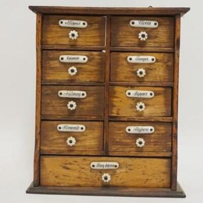 1063	HANGING WOODEN SPICE RACK, ALL ORIGINAL W/ALL KNOBS & LABELS, 9 7/8 IN WIDE X 11 5/8 IN HIGH X 3 3/8 IN DEEP
