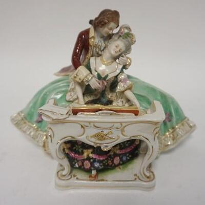 1050	GERMAN FIGURE OF MAN & WOMAN PLAYING PIANO, 7 IN HIGH X 9 IN WIDE
