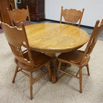 1055	CONTEMPORARY ROUND OAK TABLE W/4 PRESSED BACK OAK CHAIRS, 47 3/4 IN X 29 1/2 IN
