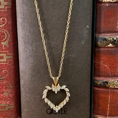 Heart shaped 14 k diamond pendant on 18 inch chain. Chain has safety latch and 4.0 g total wt.
