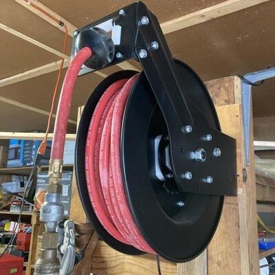 Retractable hose reel. Hose reel with 50â€™ of hose.