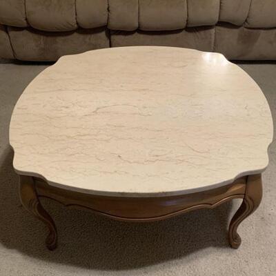 Marble Top and wood Coffee Table. Top is removable. Measures 31 1/2 sq. And 15 inches tall.