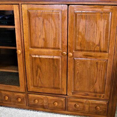 Oak entertainment center could have multiple uses.