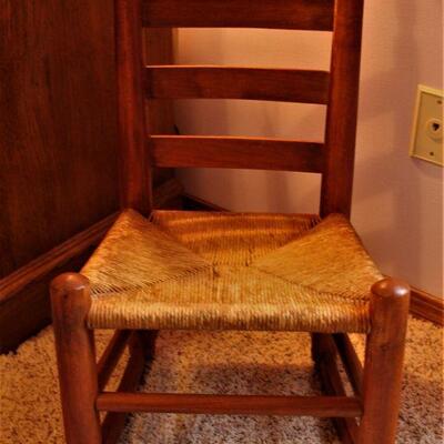 Comfortable for the little ones is this childrens rocker with a woven seat.