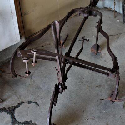 Awesome antique plow makes the perfect yard art.