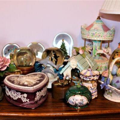 A large selection of "Music boxes" including musical snowglobes.
