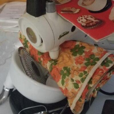 Hand mixer made by Sunbeam in the 50's, has the original paperwork