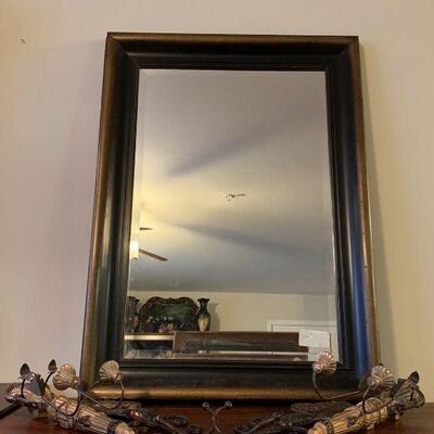 Wood framed mirror with 1 inch beveled cut face. The frame is heavy and well made. There is a set of mirrored plate holders with metal...