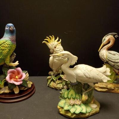 Collection of porcelain bird figures. Bluehead Parrot Andrea by Sadek is 10" and includes base. Cockatoo 9", water fowl are...