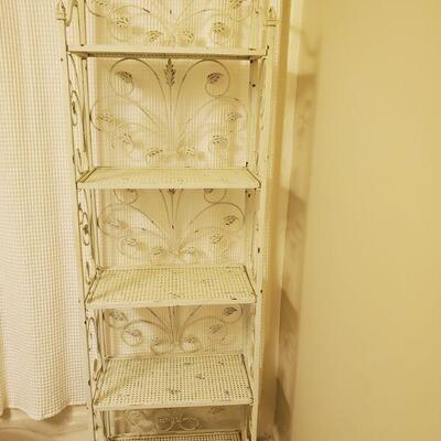 White distressed look wrought-iron rack. Measurements 22x12x72".

https://ctbids.com/#!/description/share/768245