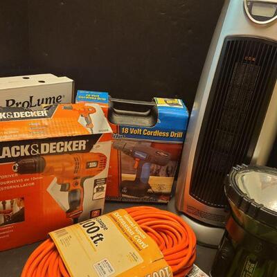 Black and Decker drill only, has drill no bag. Two halo lights, a cordless spotlight, oscillating fan heater measures 9" x 9" x...