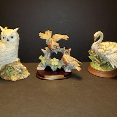 Collection of porcelain bird figures. Owl 8.5", robins 8", swan 8" https://ctbids.com/#!/description/share/768255 