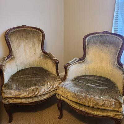 Two vintage chairs in ok condition, they have a small flower detail on front legs, middle bottom frame and middle top of frame. Measures...