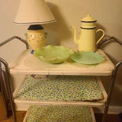 Three tier rolling cart squeaks a little when rolling. Measures 30" x 15" x 33". Small table lamp, 2 plates and a ceramic...