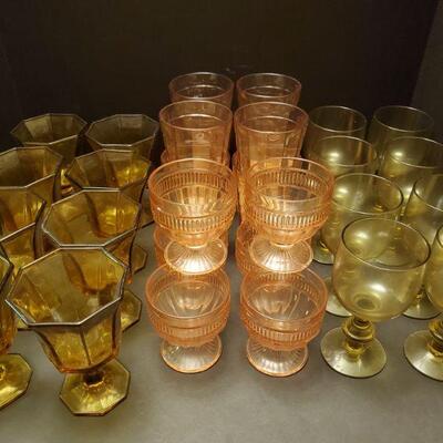 4 sets of colored glasses. Brown goblets 6" Pink coolers 6" Pink goblets 4" Smoked goblets 6"...