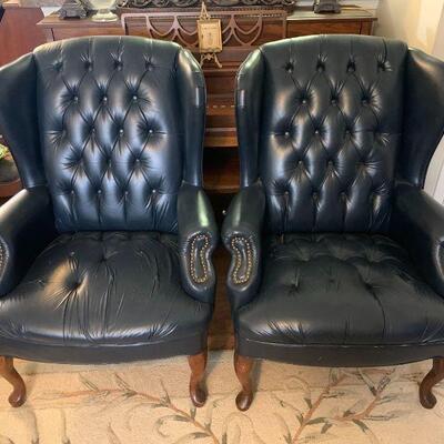 Two matching wingback armchairs, brass stud accents and Tufted cushions with some missing buttons and minimal scuffs and abrasions...