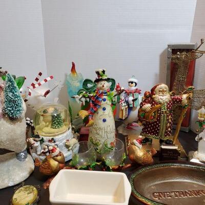 Assorted Christmas decorations includes cute snowmen, Santa and more. Snow globe plays music but is not working....