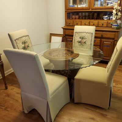 https://ctbids.com/#!/description/share/768264 Beautiful wooden pineapple pedestal base table with heavy glass top with scalloped edging....