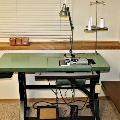 A commercial serger by Brother comes complete with work table.