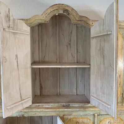 Hand painted distressed 2PC imported cabinet. Bottom piece measures 72" wide and 36.5" high. Top piece measures 69" wide...