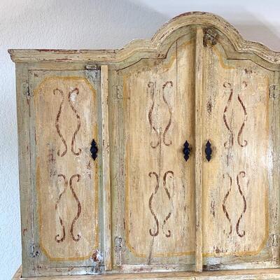 Hand painted distressed 2PC imported cabinet. Bottom piece measures 72" wide and 36.5" high. Top piece measures 69" wide...